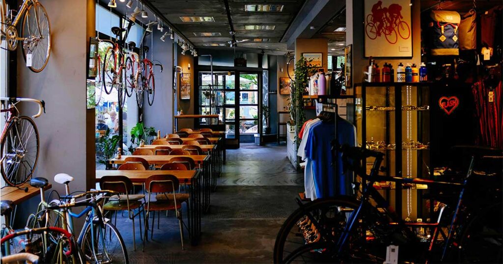 An empty bike shop with displays and bikes on the floor, representing how music and sound shape the customer experience and drive sales.