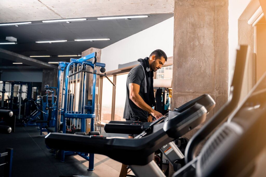 Boutique fitness studio with open workout space where curated background music supports the member experience