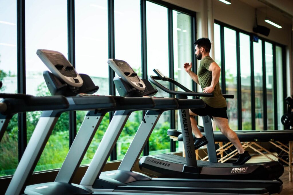 Gym cardio floor where background music helps set workout energy and pace for members