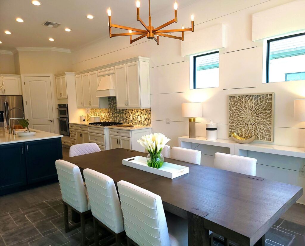 Staged model home interior with furniture and an open living space